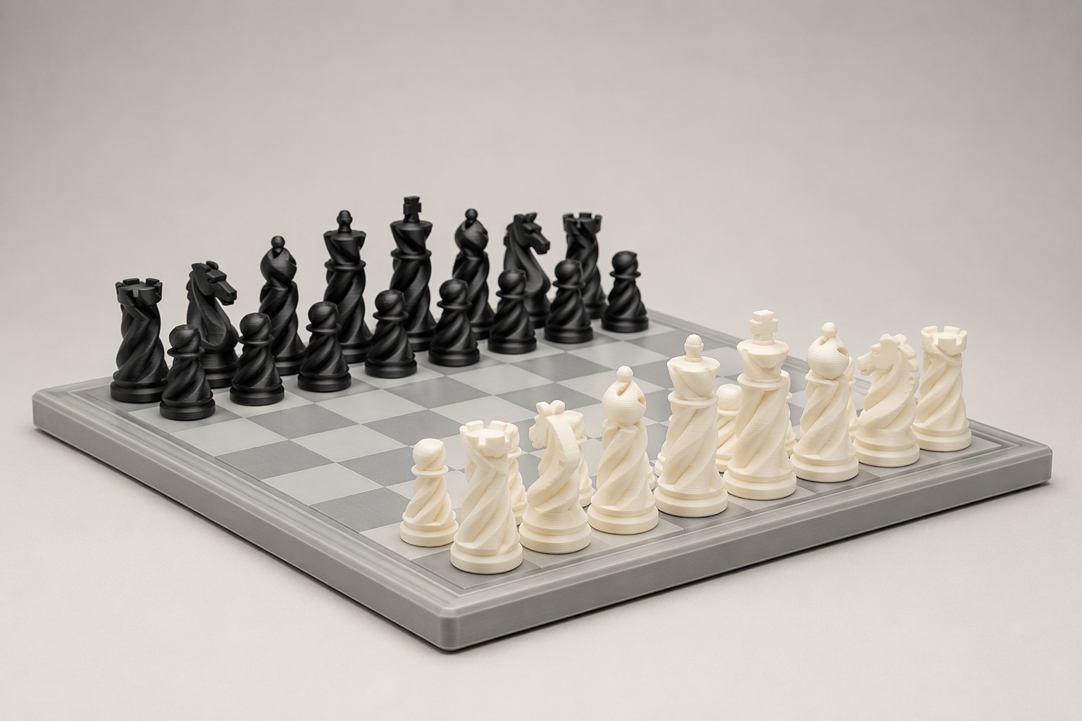 3D printed spiral chess set in black and white